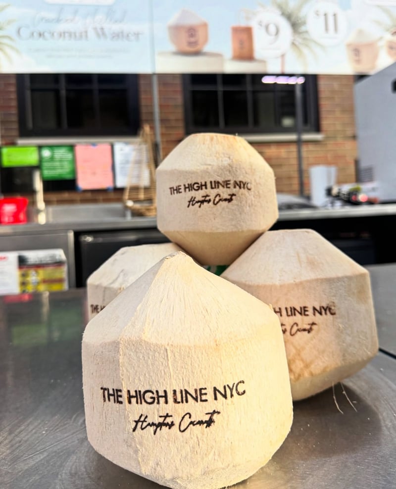Custom-branded coconuts at The High Line at golden hour